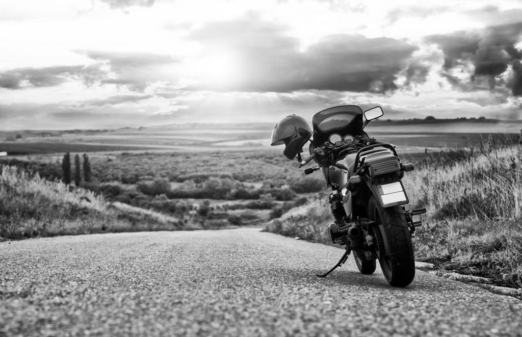 Membership Benefits 1 Vintage motorcycle on road adventure for GAOP History page